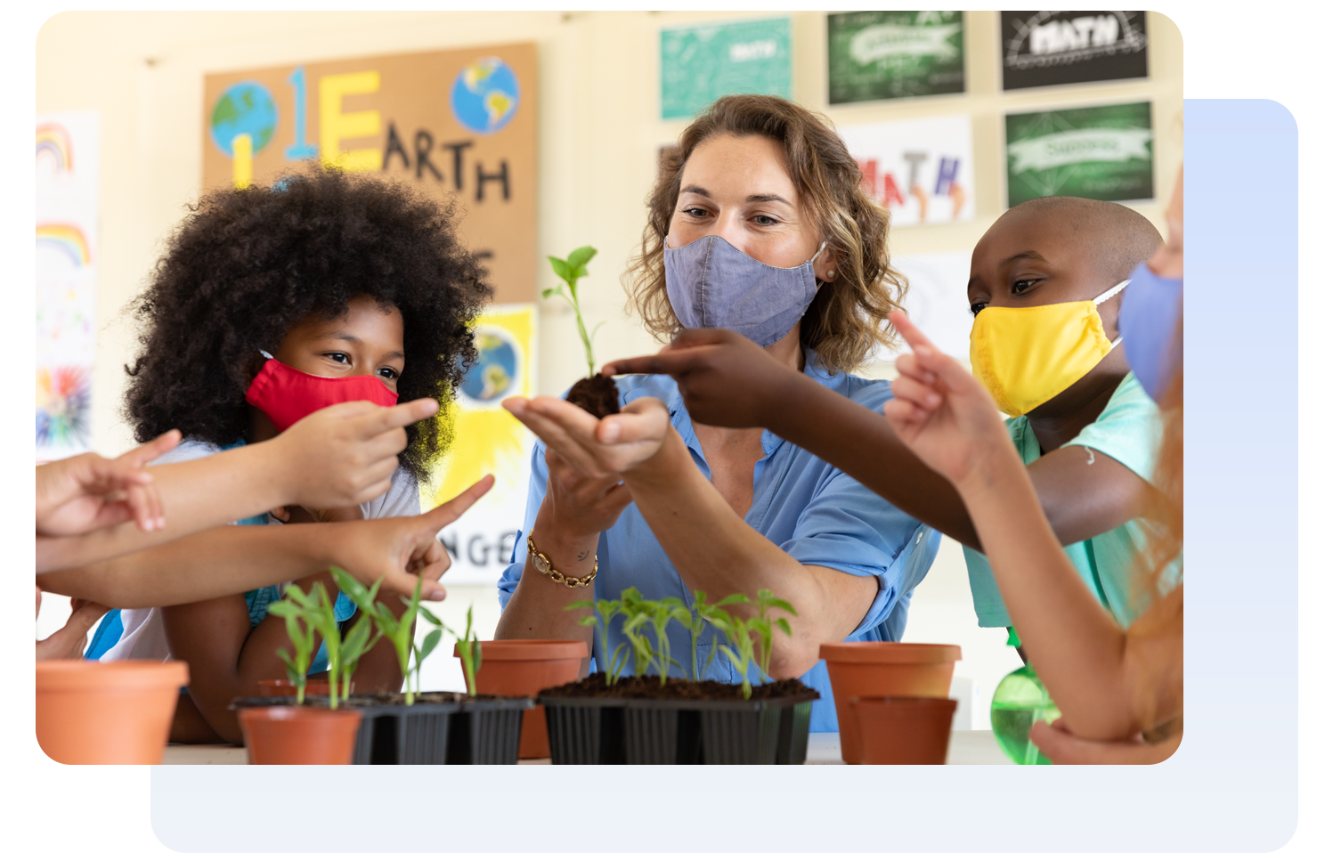 Teacher with students studying plants